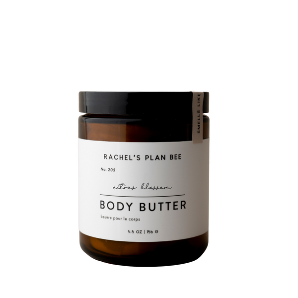 Jar of Rachel’s Plan Bee Citrus Blossom Body Butter with creamy whipped texture on white background.